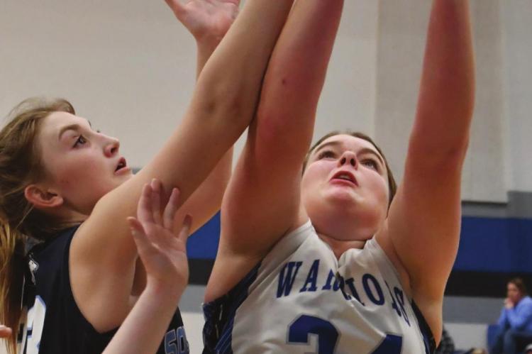 Arapahoe’s Hope Koller goes up for a rebound.