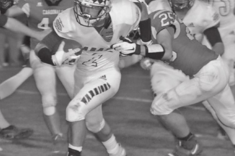 Arapahoe’s Wyatt Jenkins breaks away from an Alma defender on a run Friday night.