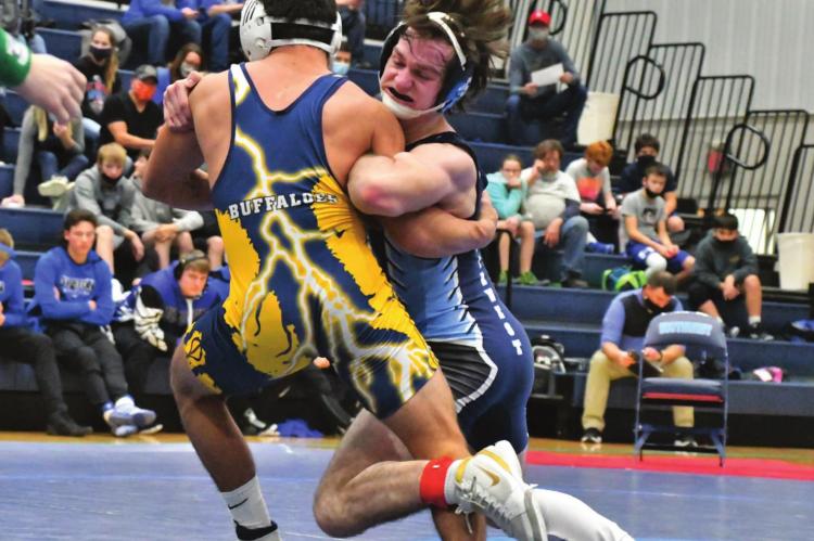 Southwest’s Brett Tryon takes an Elm Creek opponent to his back.