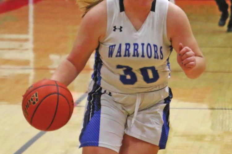 Arapahoe’s Gentry Warner drives the floor after a steal.