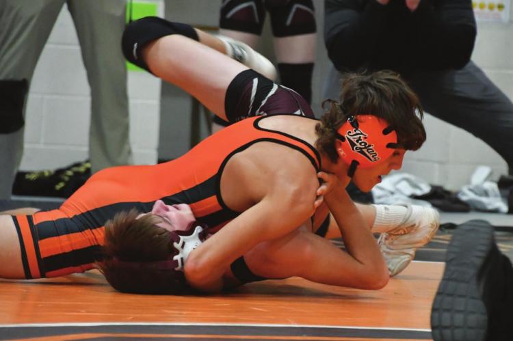 Cambridge’s Dierks Sayer earns a pin.