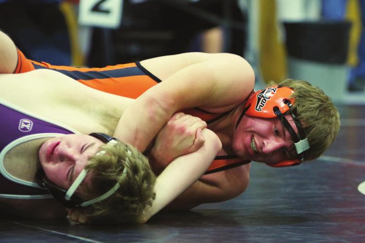 Cambridge’s Wyatt Ervin puts an opponent to his back.