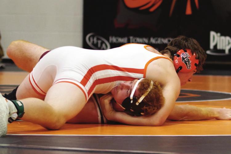 Cambridge’s Julien Grindle earns a pin.
