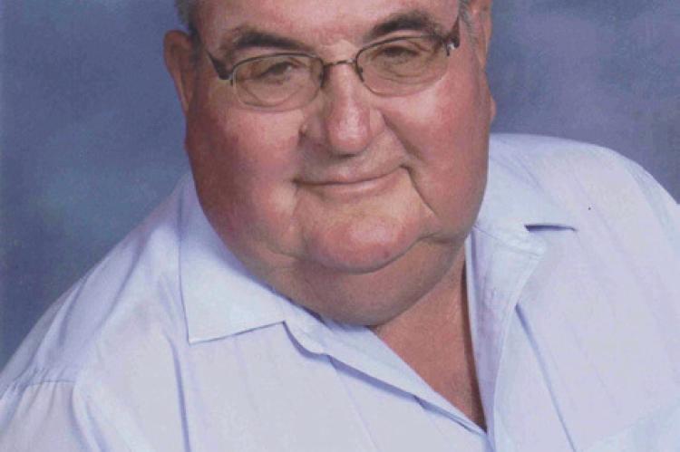 LARRY L. WARNER