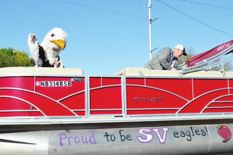 Middle Left: The Southern Valley Eagle and superintendent Bryce Jorgenson took part in the parade.