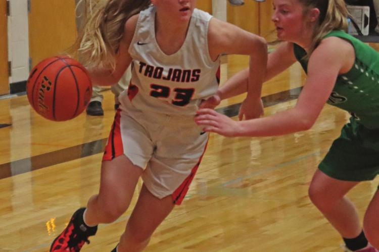 Cambridge’s Breelle Miller drives into the lane.