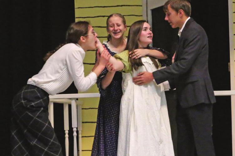 PIctured are Jalen Kent, Gaby Raburn, Grace Brown and Shane Horwart during a scene from their One Act Production of “The Miracle Worker,” which finished fourth at the NSAA State Play Production competition last week.