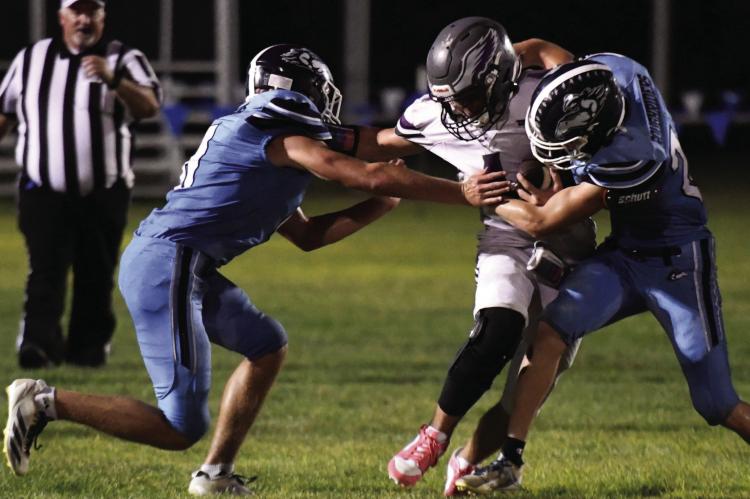 Southwest’s Bo Truksa and Jacob Barber bottle up the Garden County ballcarrier. Southwest held Garden County to just 56 yards rushing Friday night.