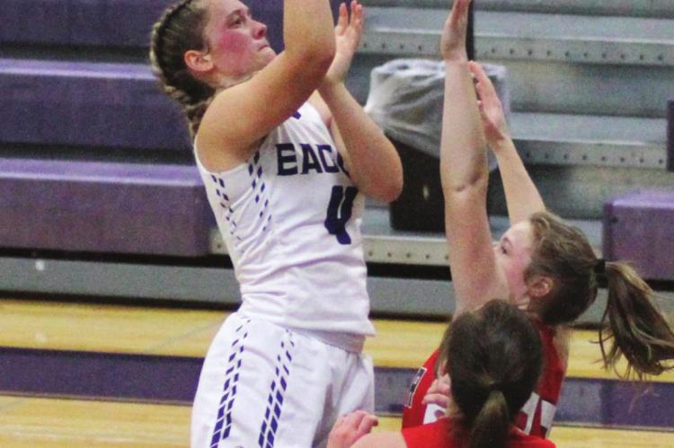 Southern Valley’s Kynlee Marquez rises in the lane for a jumper over a defender.