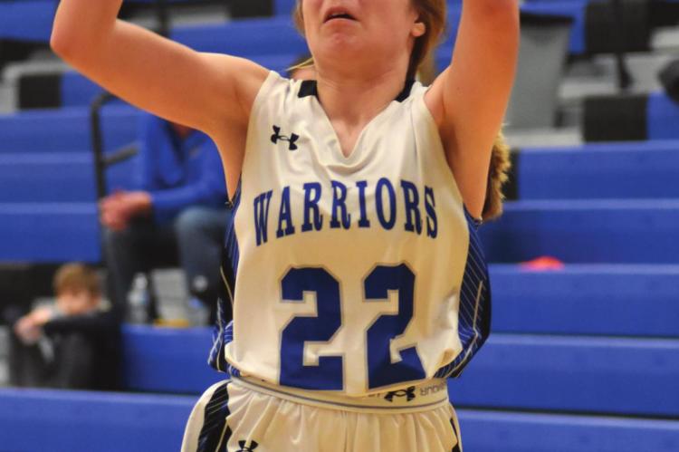 Arapahoe’s Berkley Warner puts up a shot in transition.