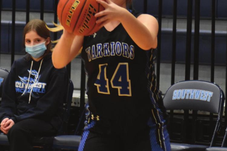 Arapahoe’s Jadan Schulz launches a shot from the corner.