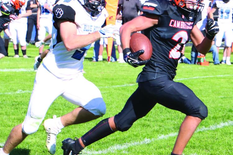 Cambridge’s Cole Cobb breaks away for a fourth-quarter touchdown run.
