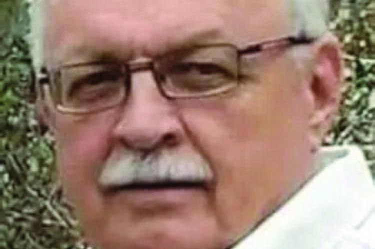 JOHN N. OMMERT