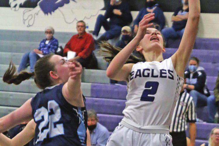 Southern Valley’s Ann Bose lays a shot off glass over Southwest’s Caylin Barnett.