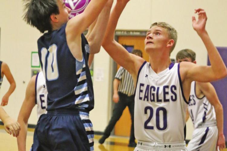 Southwest’s Cole Barnett rises over Southern Valley’s Adyn Thooft for a shot in JV boys action.