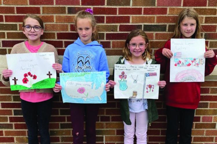 Winners of the American Legion Auxiliary Poppy Poster Contest from Eustis-Farnam are L-R: Avery Oberg-5th grade, Anne Wahl-3rd grade, Olive Schurr-2nd grade, Addy Widick- 4th grade.