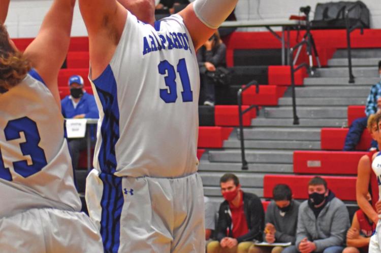 The Warriors’ Austin Roush snares a rebound.