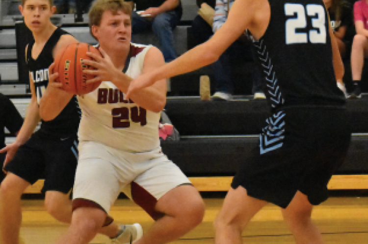 Cade Schmidt makes a move in the paint.