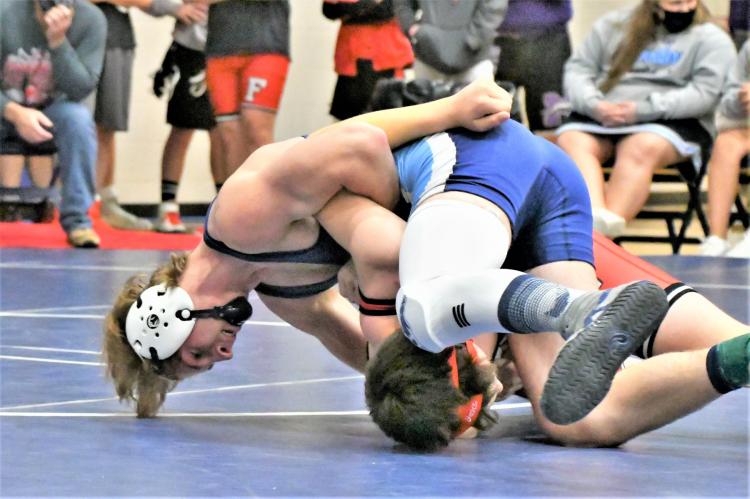 Southwest's Matt Van Pelt works to a pin.