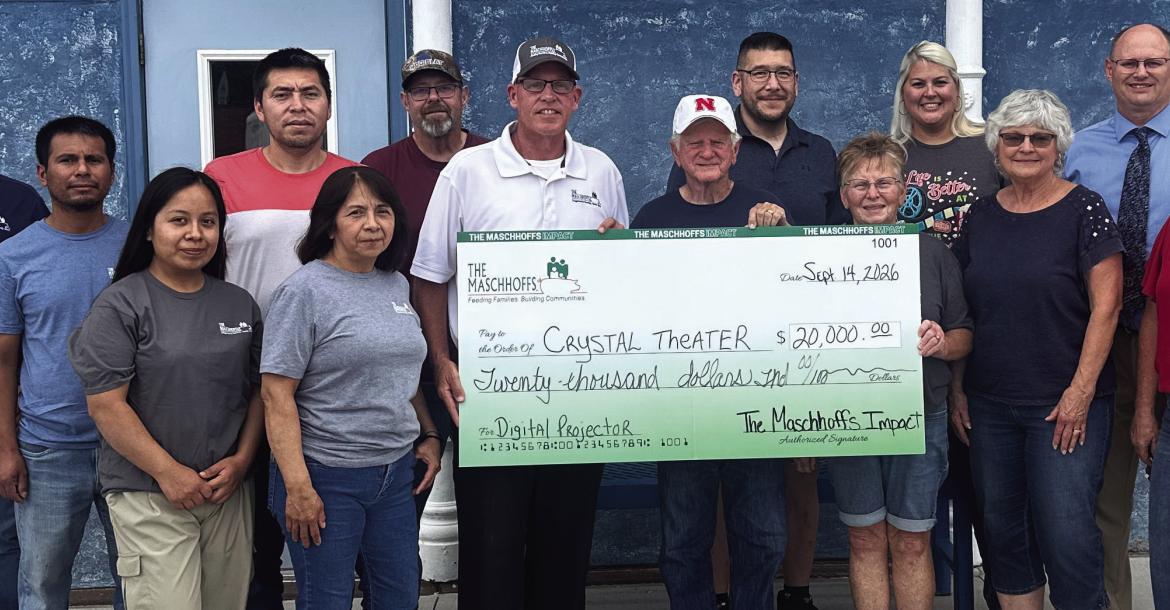 Pictured at The Maschhoffs check presentation to the Crystal Theater are, front row left: Carmen Zamora Bernardino, Celia Martinez, Mike Harris, Don Sandel, Connie Hoefs, Linda Hamel and Bev Osiecki. Back row: Roger Hinz, Luis Javier Salomon Victoriano, Alejandro Canas Navarro, Harley Lambert, Erick Lee, Tiffany Downey and Ben Ellis.