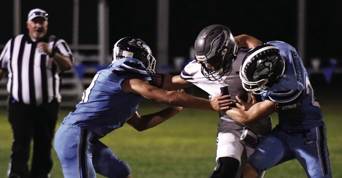 Southwest’s Bo Truksa and Jacob Barber bottle up the Garden County ballcarrier. Southwest held Garden County to just 56 yards rushing Friday night.