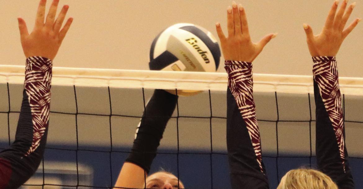 Desi Farner (above) attacks while Ruby McCune and Cydney Carlson (below) block an attack.