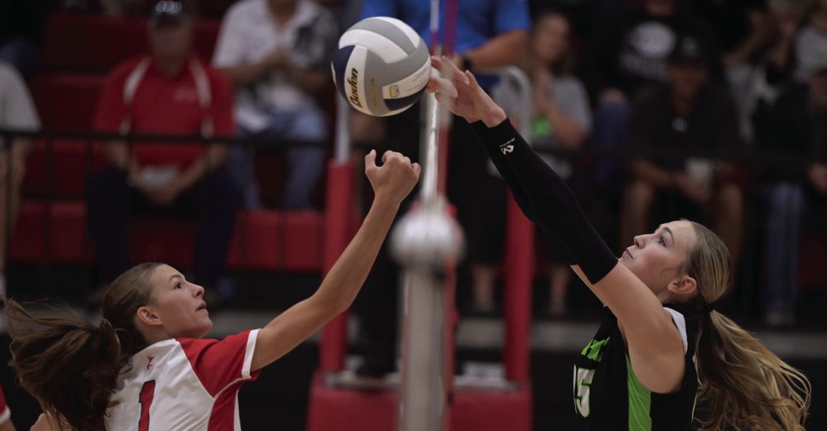 MHC’s Addison Richards rejects a Valentine attacker.