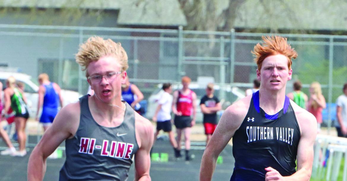 Hi-Line’s Finn Kerznar and Southern Valley’s Tylor Grove approach the finish in the 100 prelims. Kerznar eventually finished third in the event.