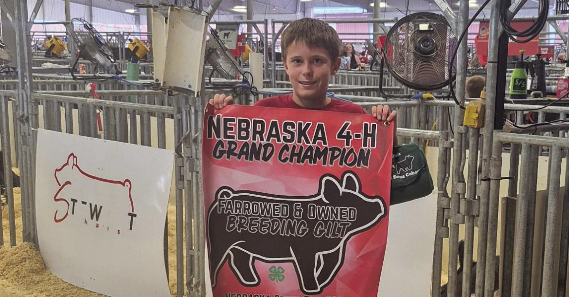 Frontier County’s Hunter Snyder is pictured with his Grand Champion Breeding Gilt from the Farrowed and Owned competition.