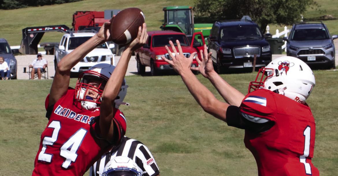 Med Valley’s Isaac Snyder takes a touchdown catch away from teammate Payton Newcomb.